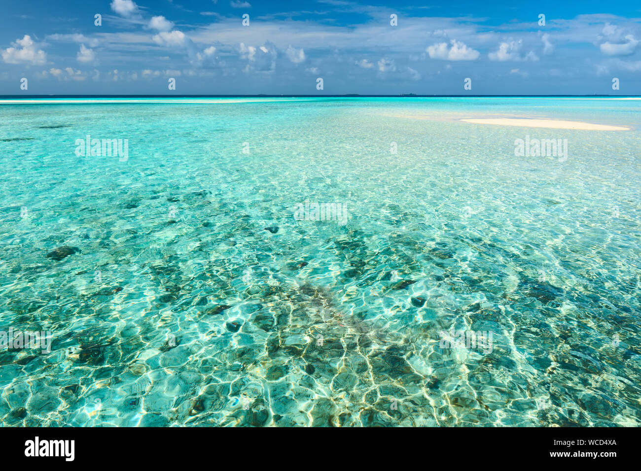 Cloudly Sky with Turquoise Ocean Stock Photo