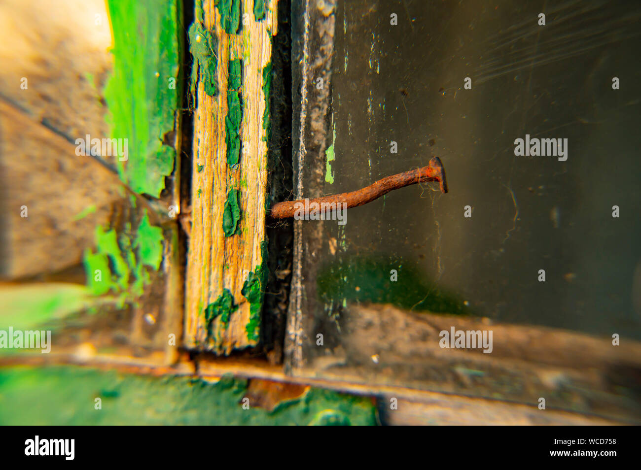 Rusty nail in the window frame. Background Stock Photo Alamy