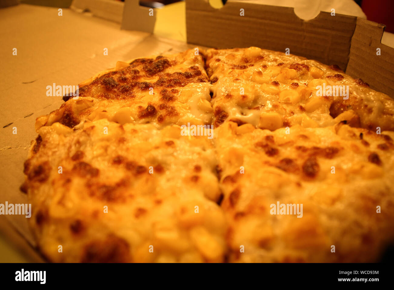 Golden corn pizza with lots of mozzarella cheese serve on pizza box Stock Photo Alamy