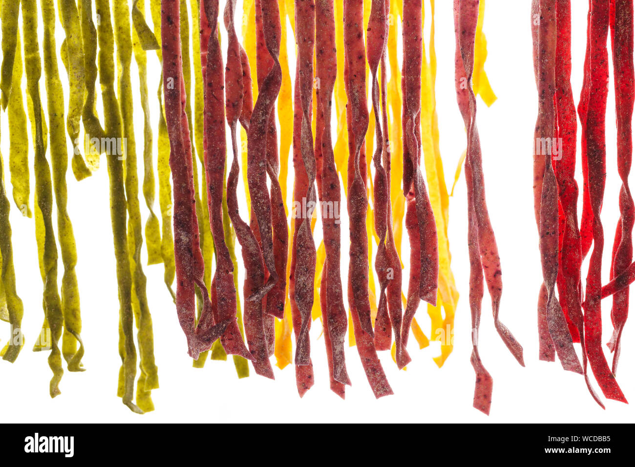 Various types of fresh homemade pasta. Raw pasta drying process