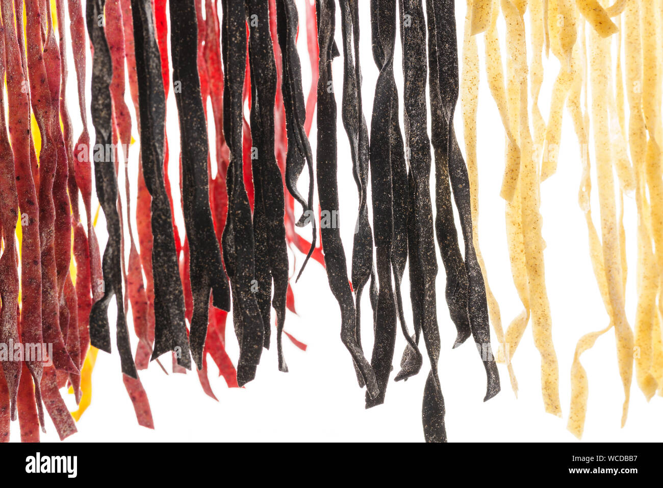 Various types of fresh homemade pasta. Raw pasta drying process