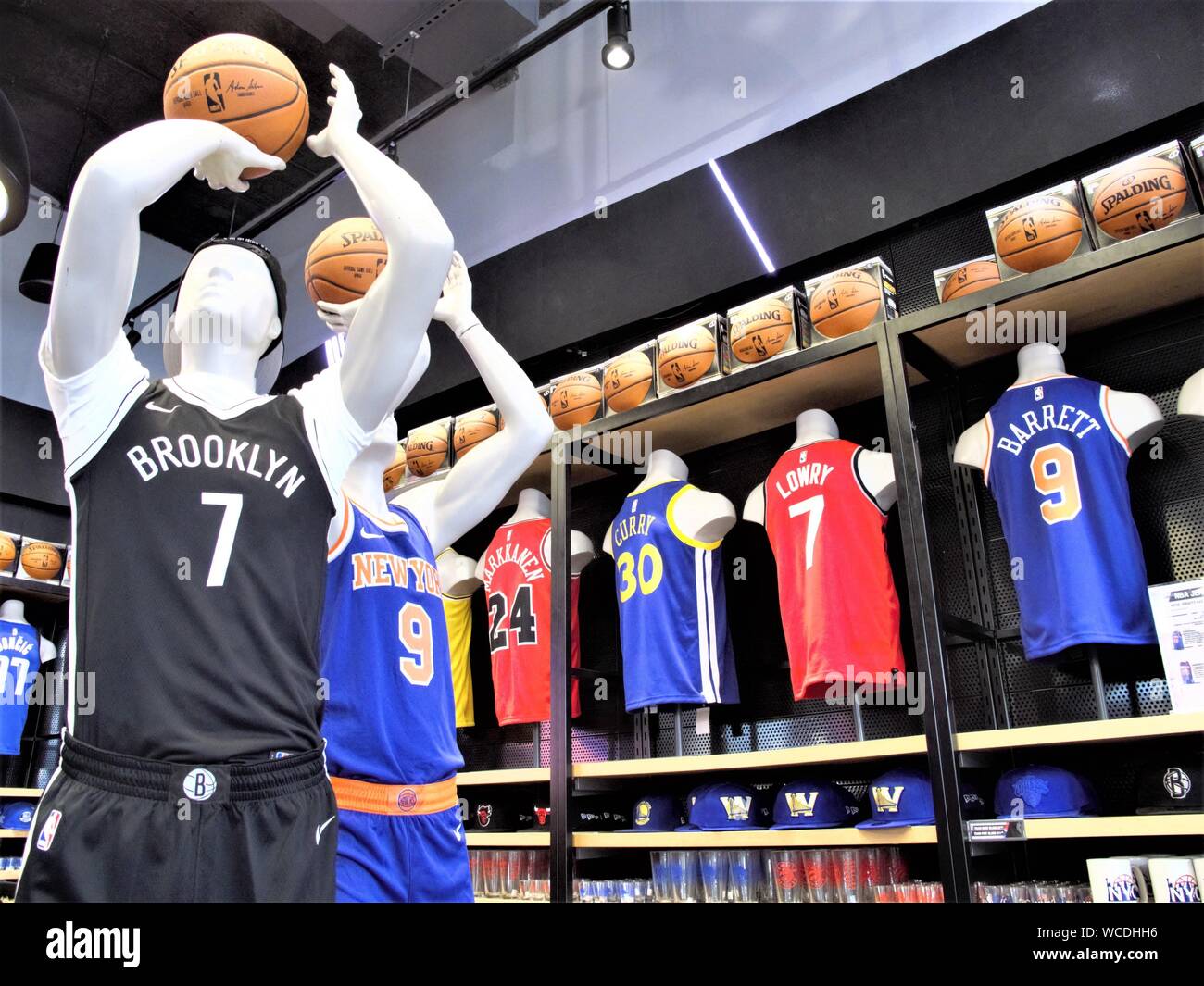 MANNEQUINS WITH COLORFUL CLOTHES INSIDE NBA STORE IN MANHATTAN NEW