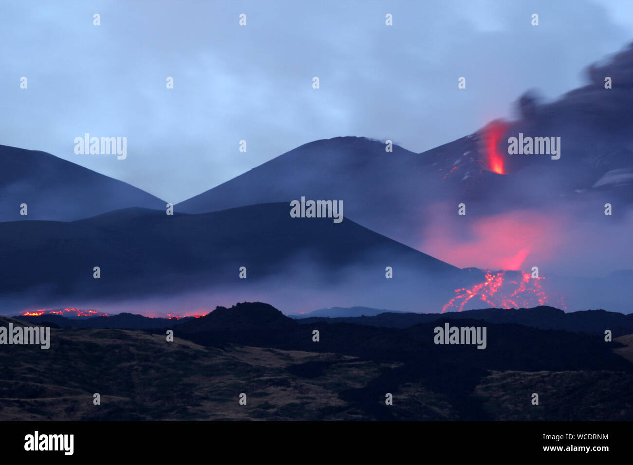 Mount Etna, Europe's biggest active volcano, erupts a new fracture, with the lava flow going towards the Torre del Filosofo (Philosopher’s Tower) in Nicolosi, a comune in Catania, Sicily. Featuring: atmosphere Where: Nicolosi, Catania, Italy When: 27 Jul 2019 Credit: IPA/WENN.com  **Only available for publication in UK, USA, Germany, Austria, Switzerland** Stock Photo