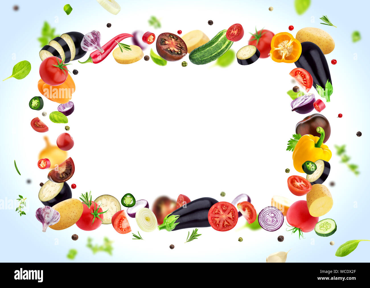 Vegetable isolated on white background, frame made of different flying vegetables, herbs and spices, with copy space Stock Photo