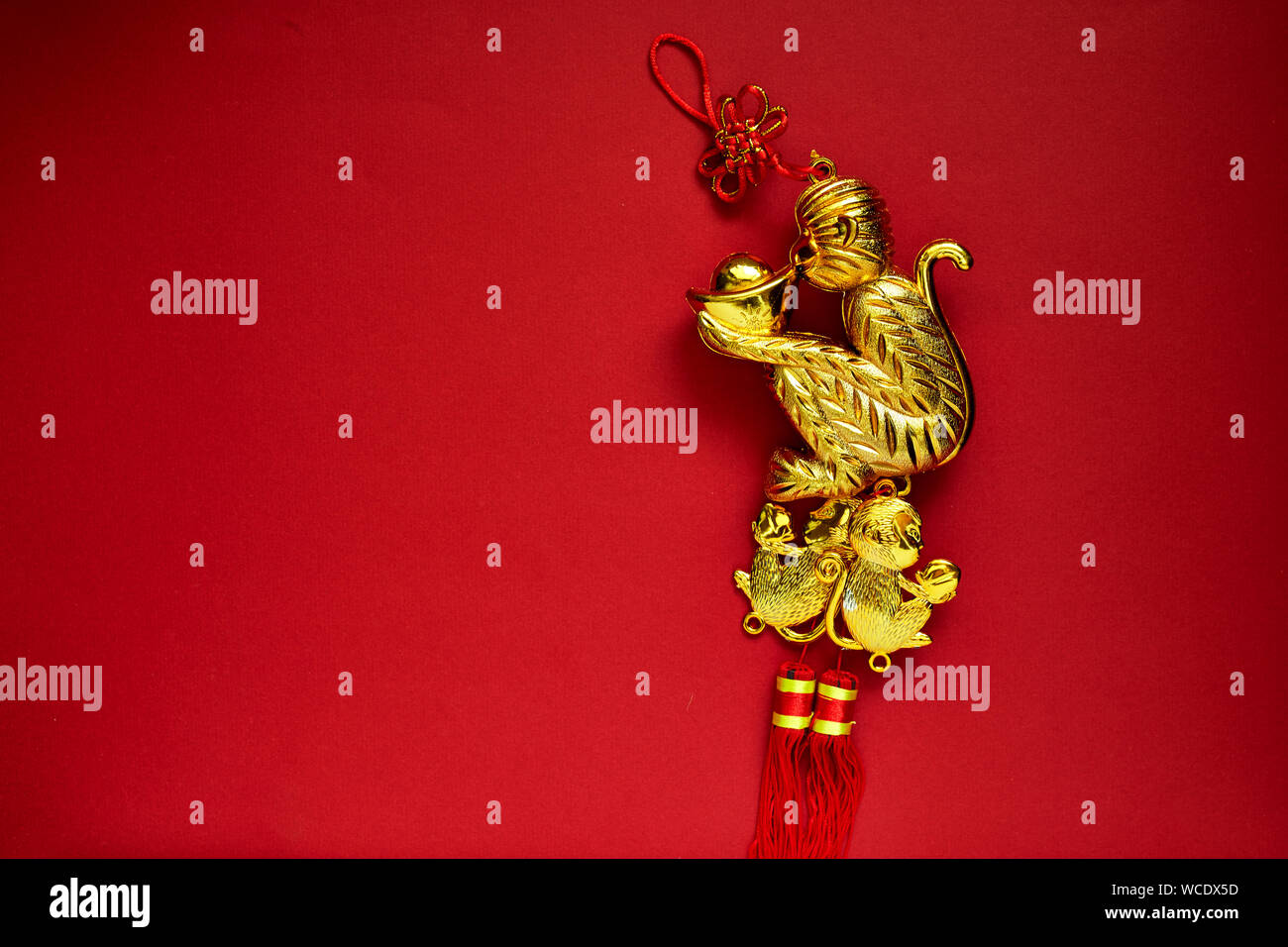 Close-up Of Gold Decor Against Red Background Stock Photo