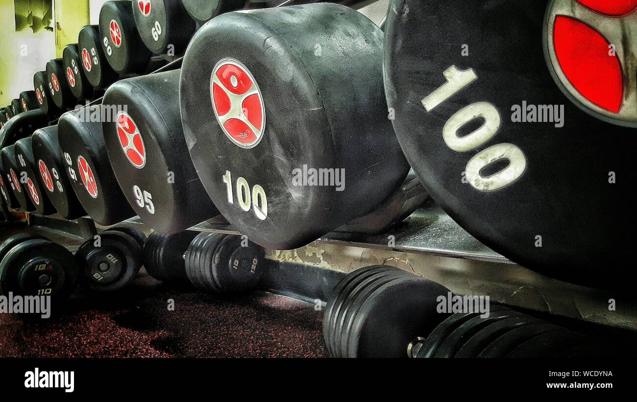 Close-up Of Dumbbells In Health Club Stock Photo