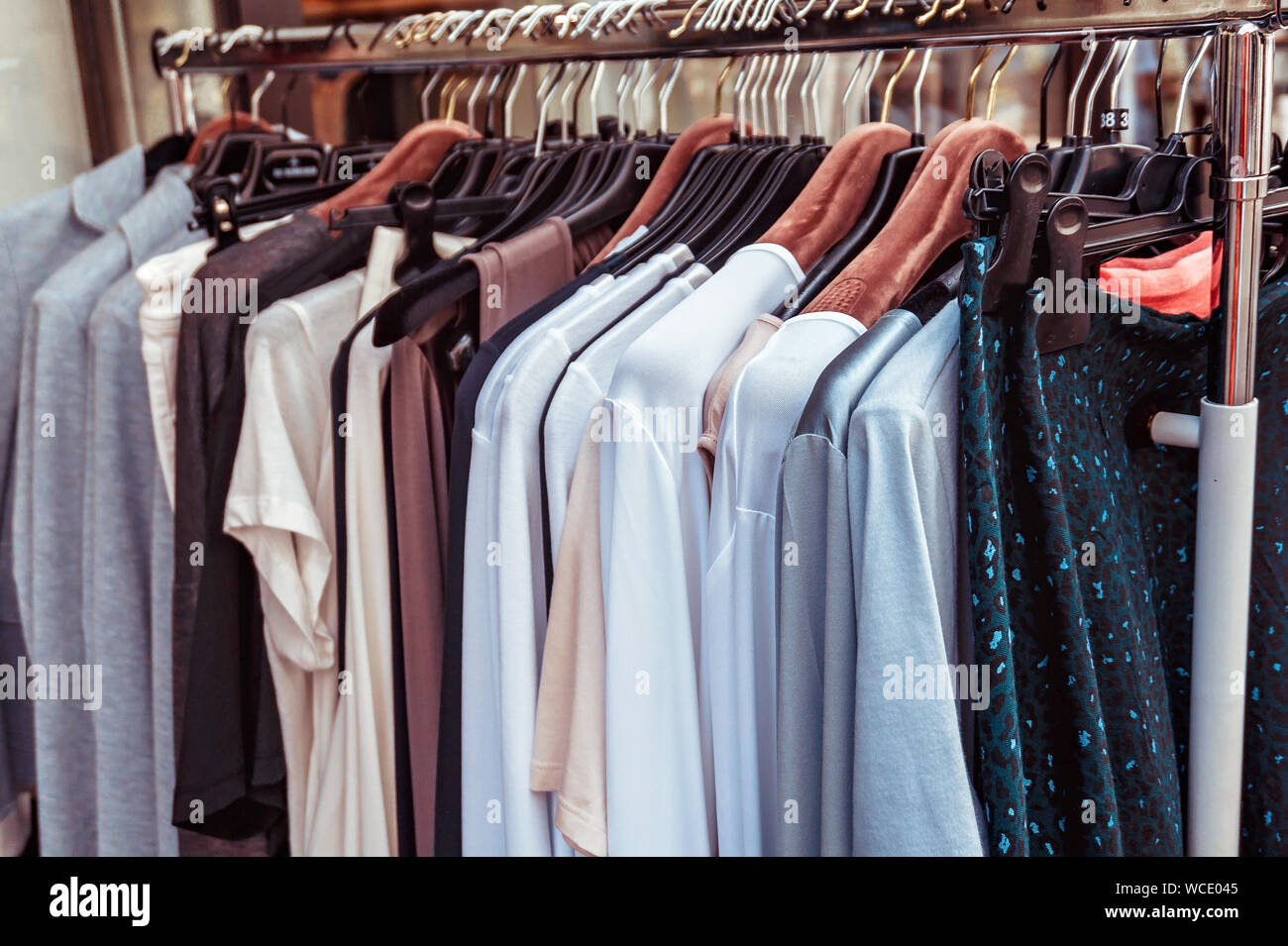 Set of row clothing on hangers. Sale shopping concept. Stock Photo
