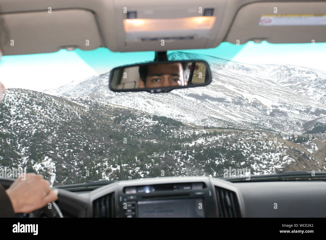 Man looking rear view mirror in car hi-res stock photography and images ...