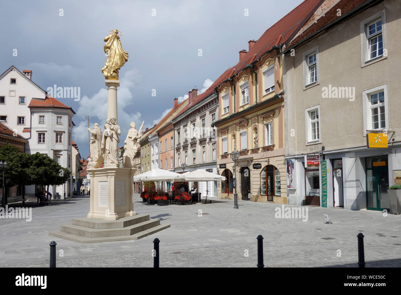 Slovenia, Celje, Main Square (Glavni Trg) with statue of bishop and writer Anton Martin Slomšek Stock Photo