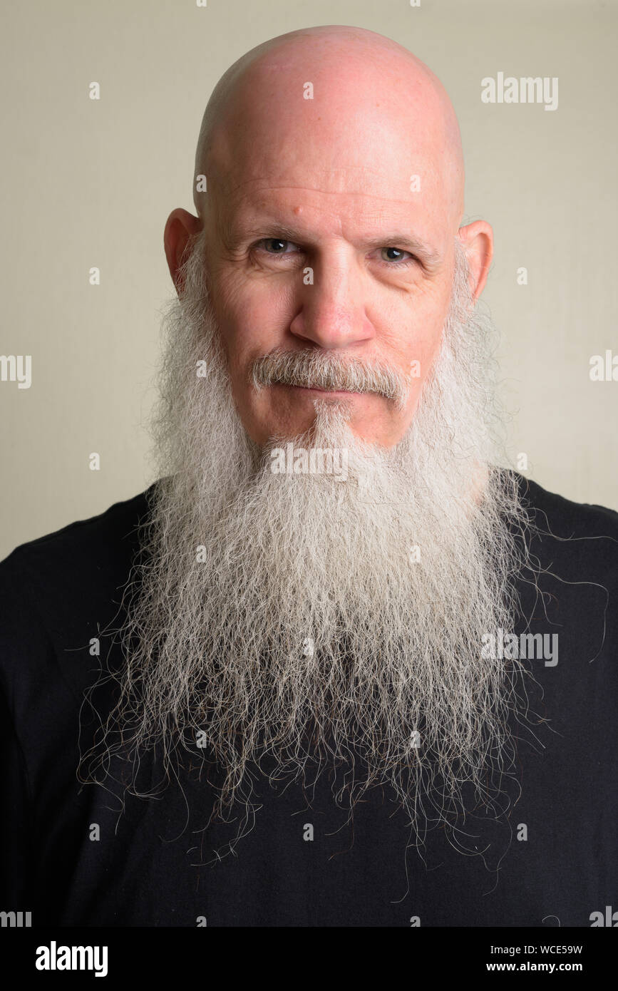 Face Of Mature Bald Man With Long Gray Beard Stock Photo