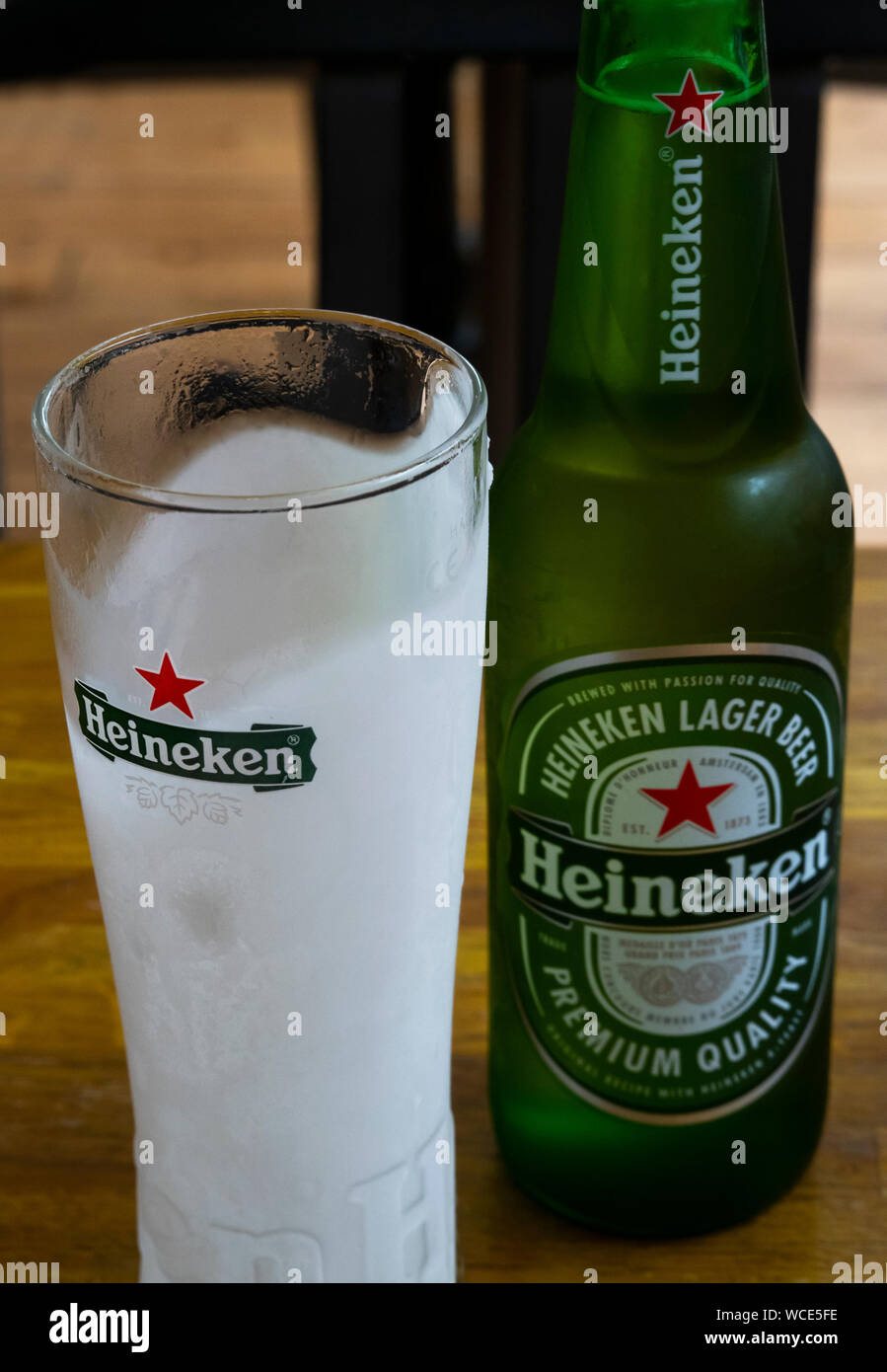 A frosted glass and a bottle of cold Heineken beer Stock Photo