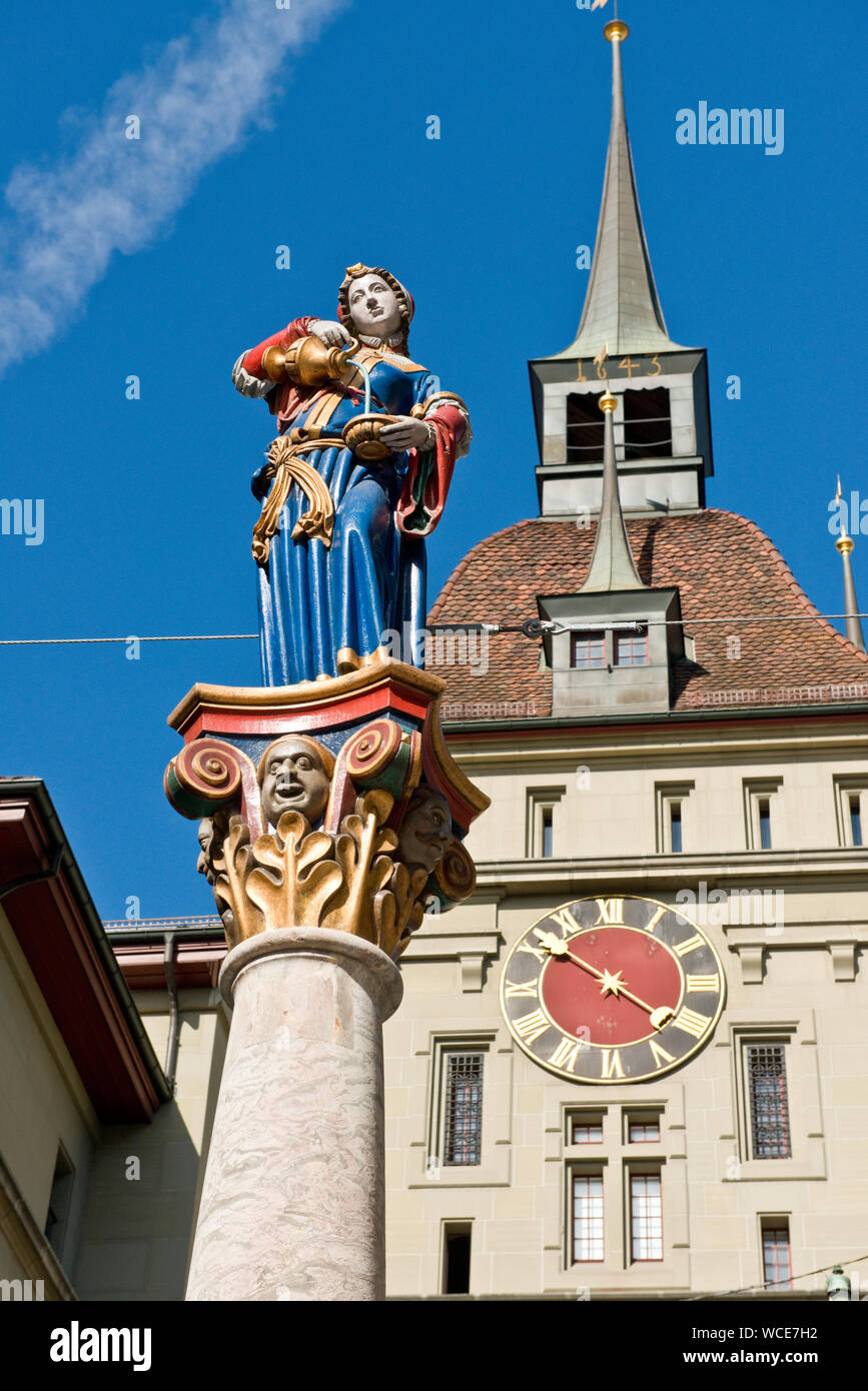 Käfigturm medieval tower and clock, and fountain with statue of Anna-Seiler-Brunnen (Anna Seller). Old Town, Bern, Switzerland Stock Photo