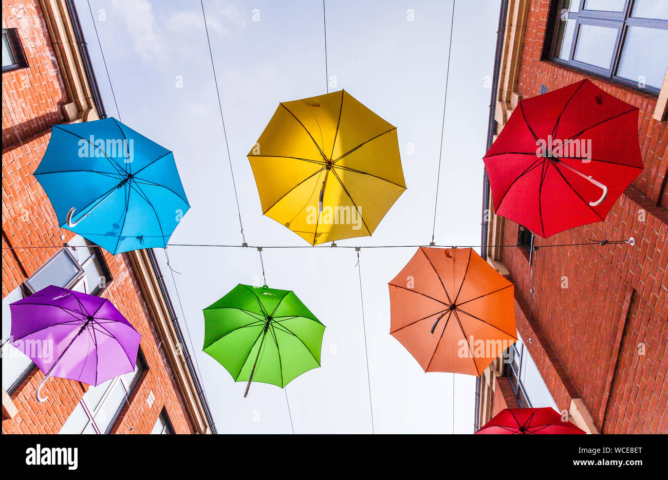 A colourful display of umbrellas hanging overhead in the Prince shopping precinct in