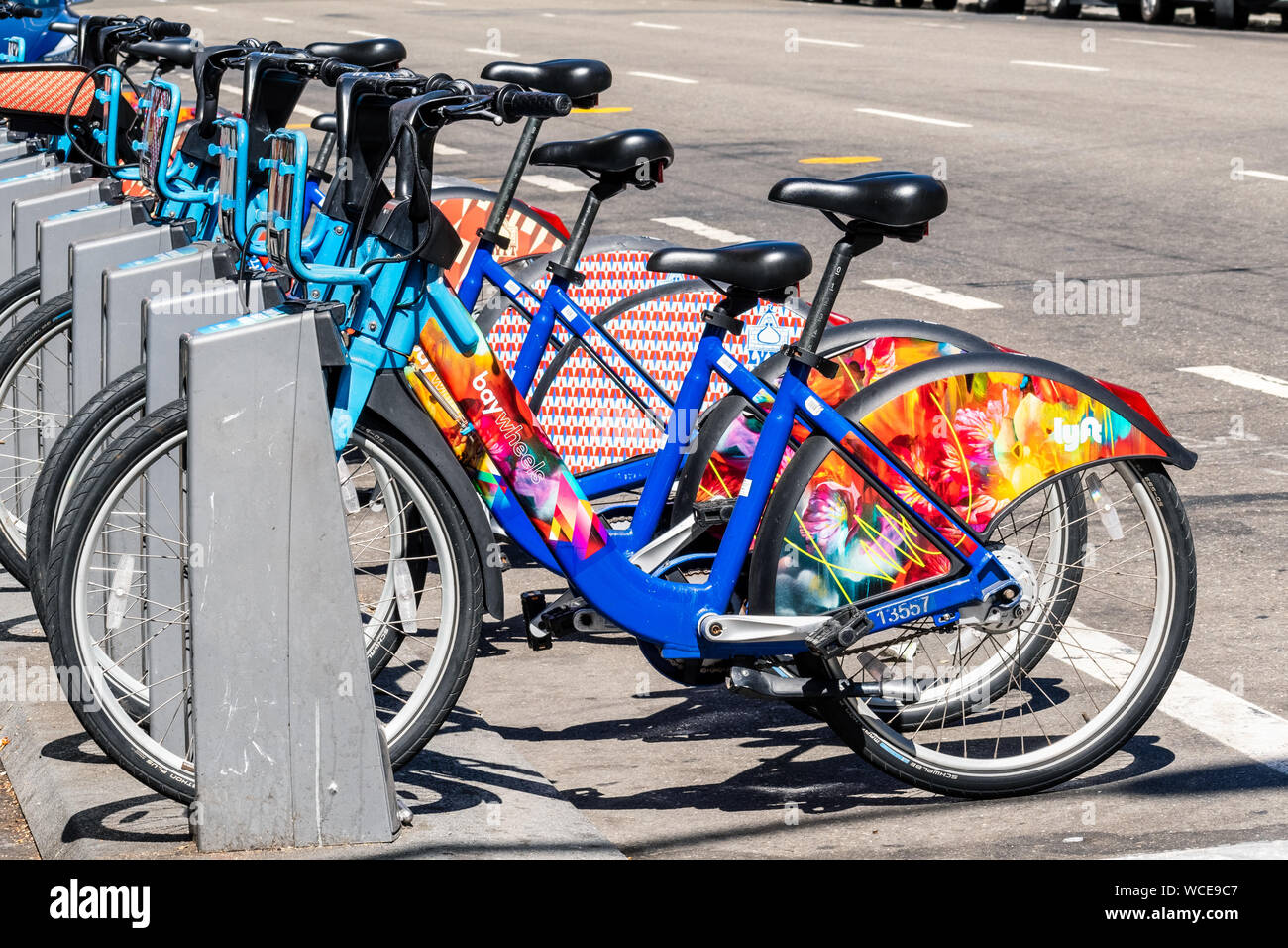Aug 21, 2019 San Francisco / CA / USA - Colorful Bay Wheels (formerly Ford GoBike) bicycles parked at a station; Motivate (the Company operating the b Stock Photo