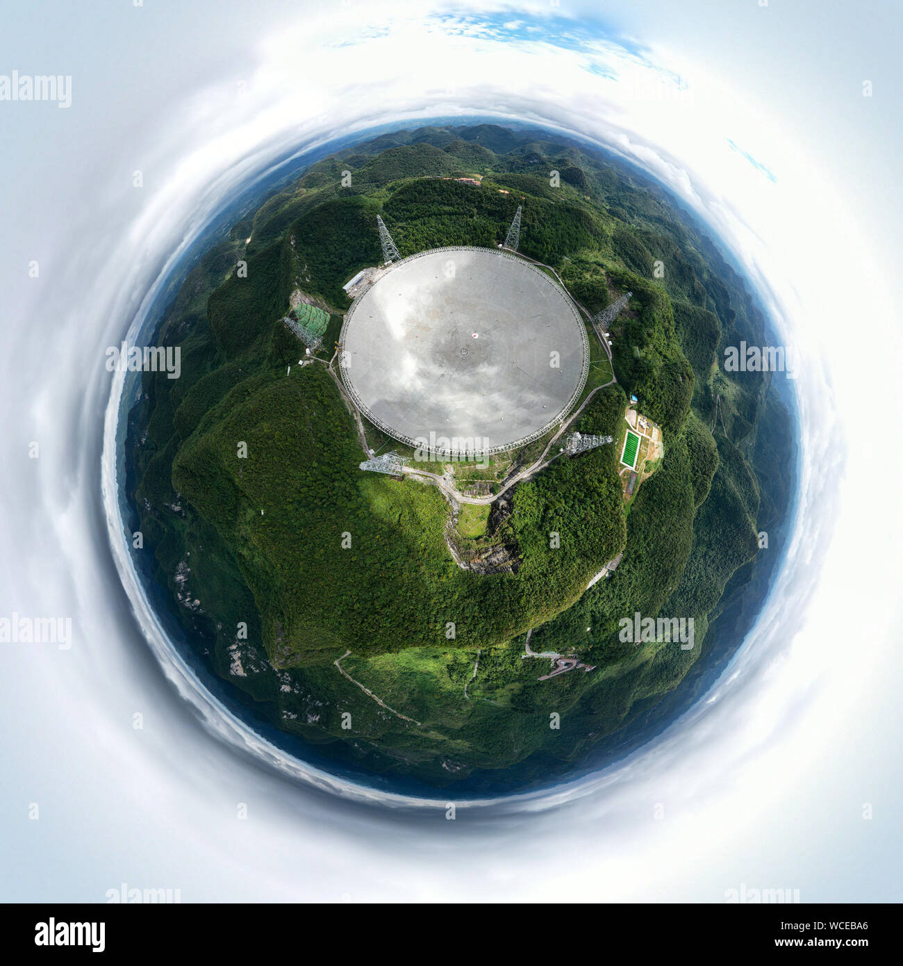 Pingtang. 27th Aug, 2019. Aerial photo taken on Aug. 27, 2019 shows China's Five-hundred-meter Aperture Spherical radio Telescope (FAST) in southwest China's Guizhou Province. China's FAST, the world's largest single-dish radio telescope, will greet the third anniversary of operation that began in September 2016. Credit: Ou Dongqu/Xinhua/Alamy Live News Stock Photo