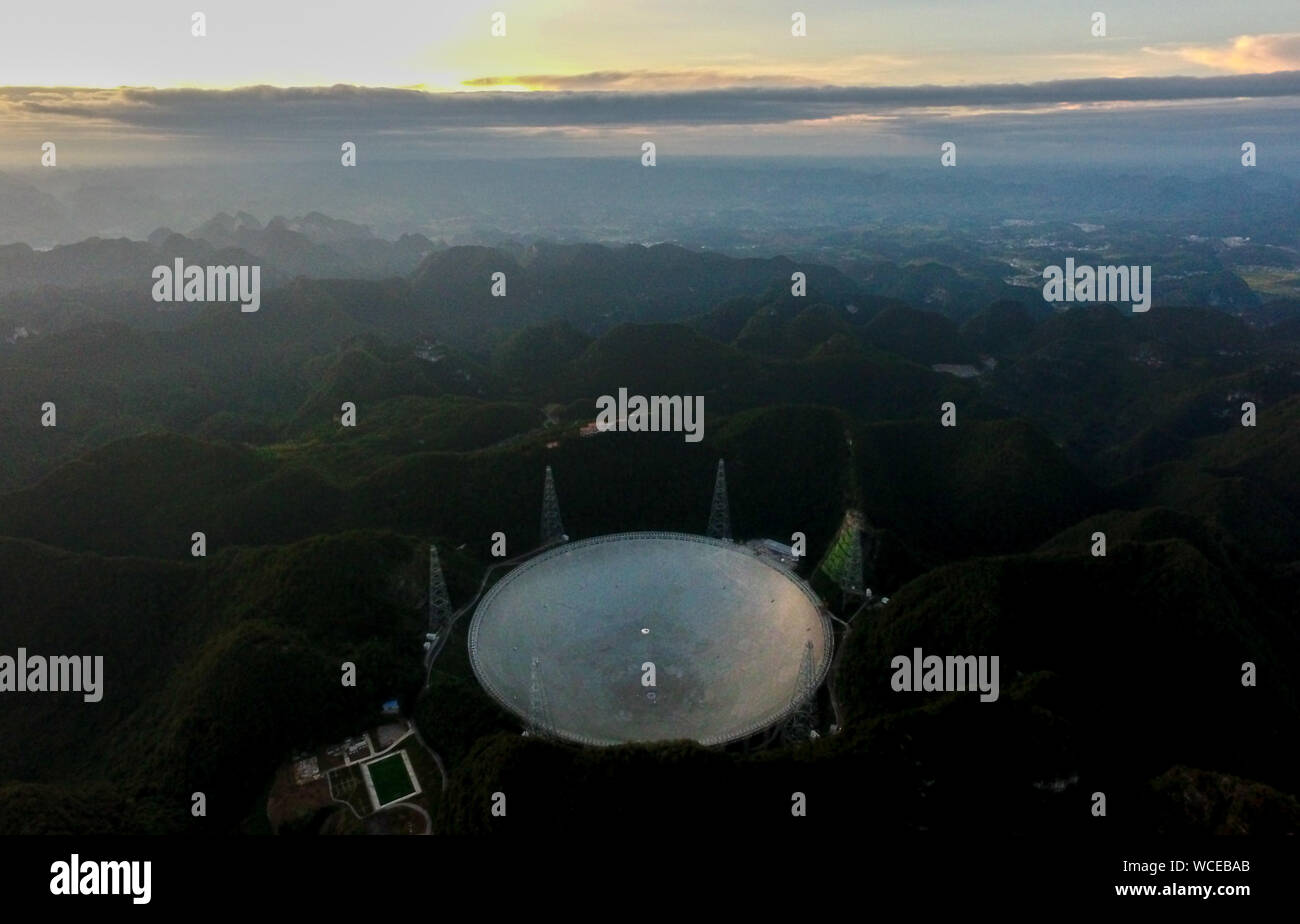 Pingtang. 27th Aug, 2019. Aerial photo taken on Aug. 27, 2019 shows China's Five-hundred-meter Aperture Spherical radio Telescope (FAST) in southwest China's Guizhou Province. China's FAST, the world's largest single-dish radio telescope, will greet the third anniversary of operation that began in September 2016. Credit: Ou Dongqu/Xinhua/Alamy Live News Stock Photo