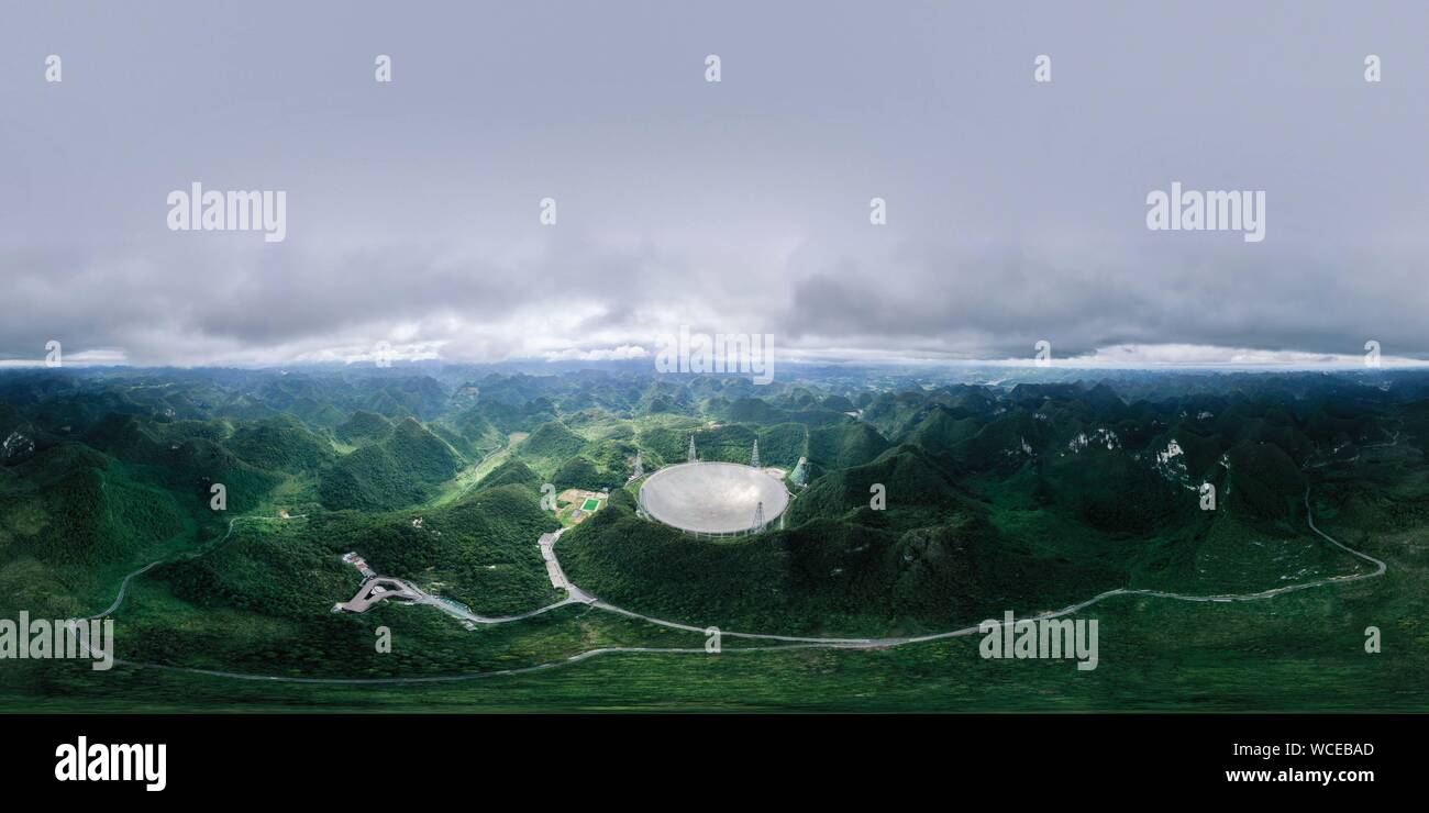 Pingtang. 27th Aug, 2019. Aerial photo taken on Aug. 27, 2019 shows China's Five-hundred-meter Aperture Spherical radio Telescope (FAST) in southwest China's Guizhou Province. China's FAST, the world's largest single-dish radio telescope, will greet the third anniversary of operation that began in September 2016. Credit: Ou Dongqu/Xinhua/Alamy Live News Stock Photo