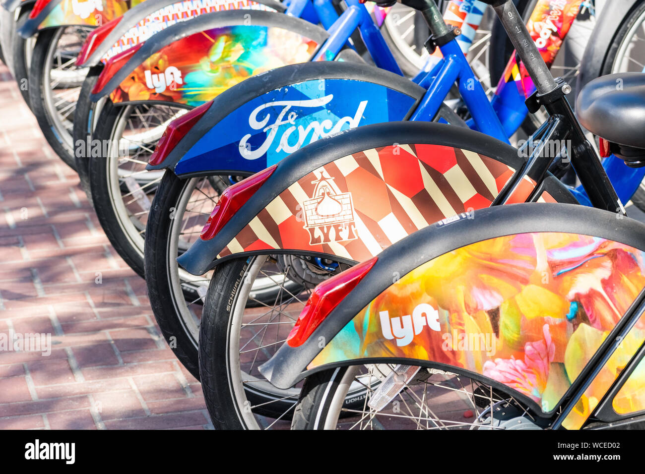 Aug 21, 2019 San Francisco / CA / USA - Colorful Bay Wheels (formerly Ford GoBike) bicycles parked at a station; Motivate (the Company operating the b Stock Photo