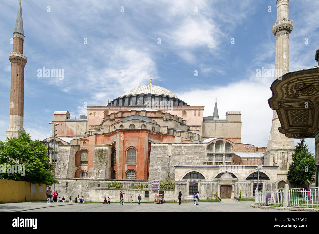 Istanbul, Turkey - June 6, 2016:  Tourists and locals walking past the magnificent Hagia Sophia former cathedral and mosque, now a museum Stock Photo