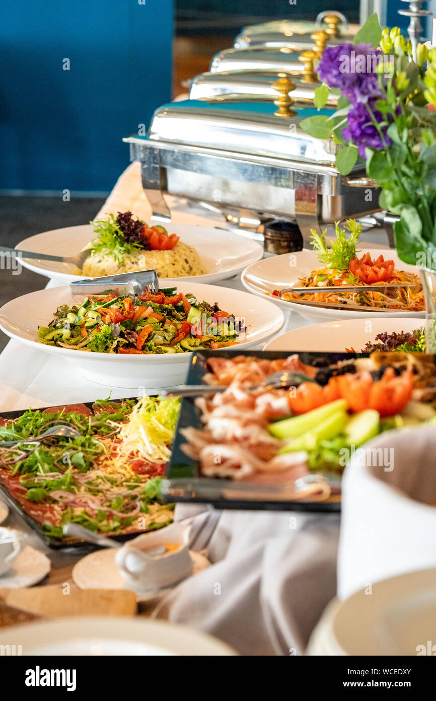 Tasty buffet with different dishes family together during party Stock