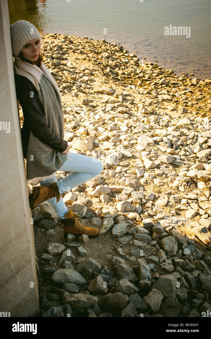 Woman leaning on rocks hi-res stock photography and images - Alamy
