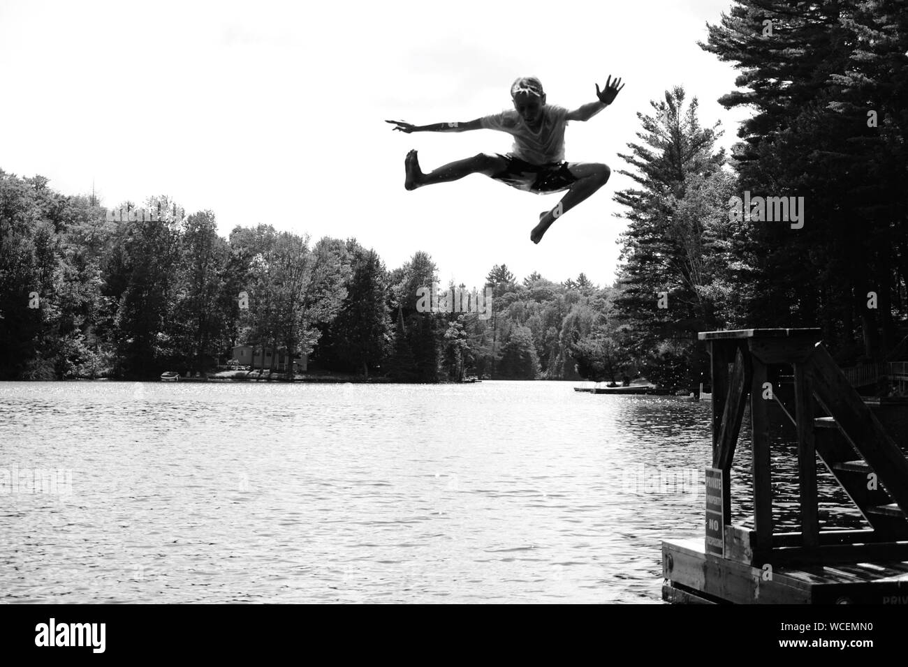 Boy jumping into river hi-res stock photography and images - Alamy