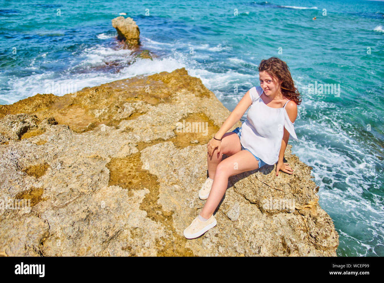 Woman cliff water hi-res stock photography and images - Alamy