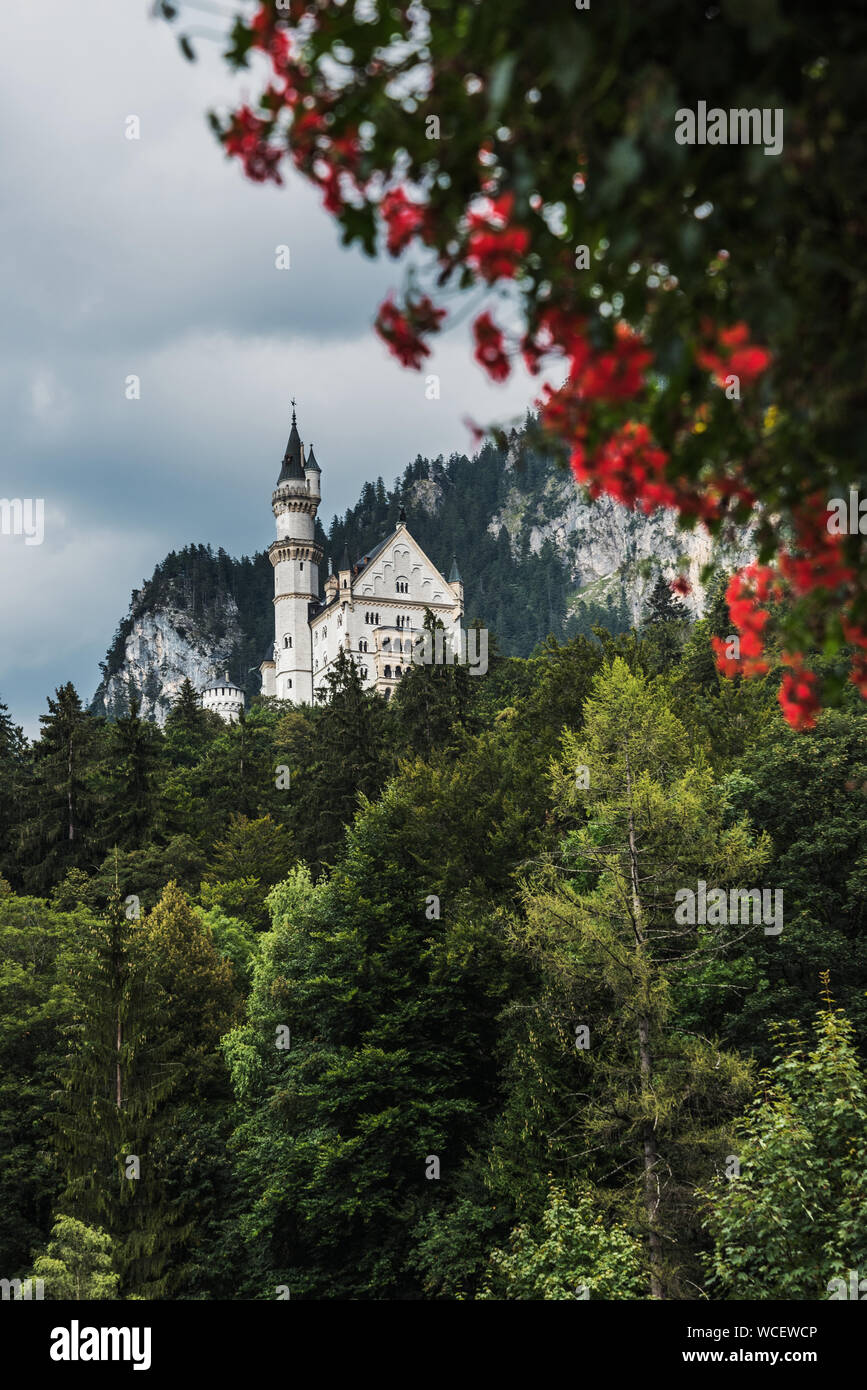 Vertical view from the village of Hohenschwangau on the Neuschwanstein castle - famous Europe, and German Landmark in style of Romanesque Revival arch Stock Photo