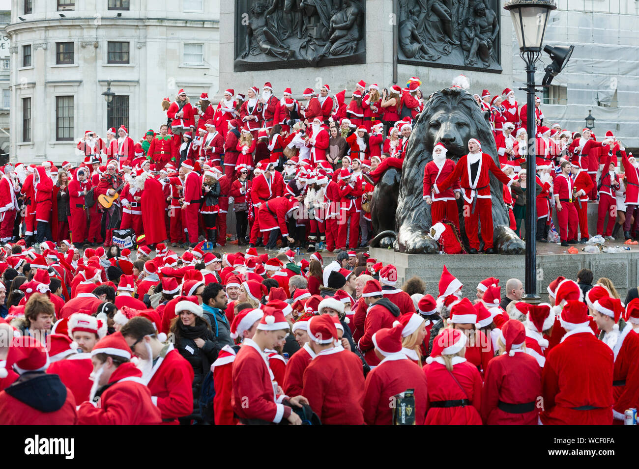 Hundreds of Santas flood Trafalgar Square for the annual, global phenomenon of Santacon. There was carolling and sprout throwing, many takes on the tr Stock Photo