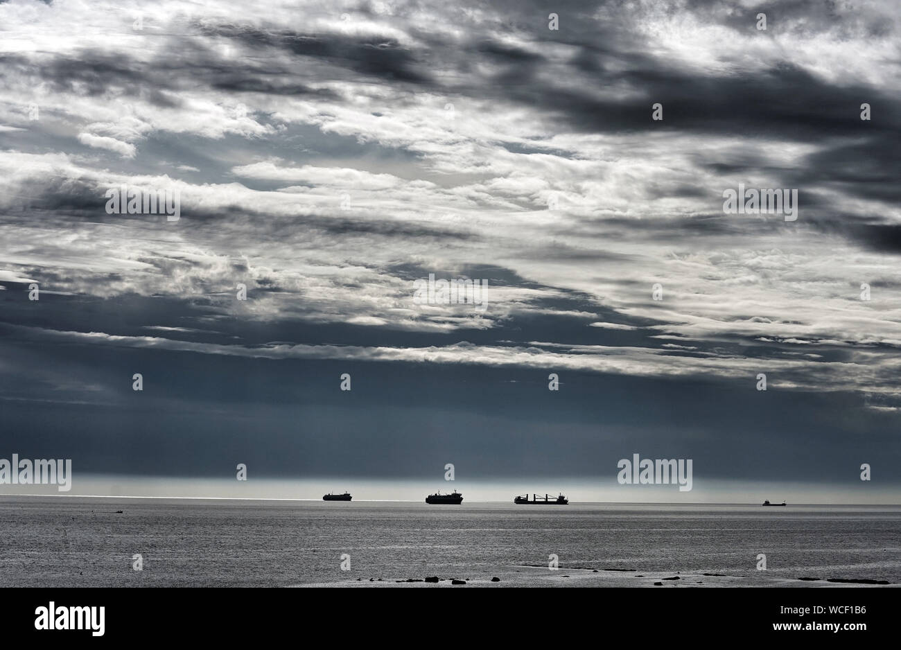 Ships at sea, as storm clouds roll in off, the coast of Whitley Bay ...