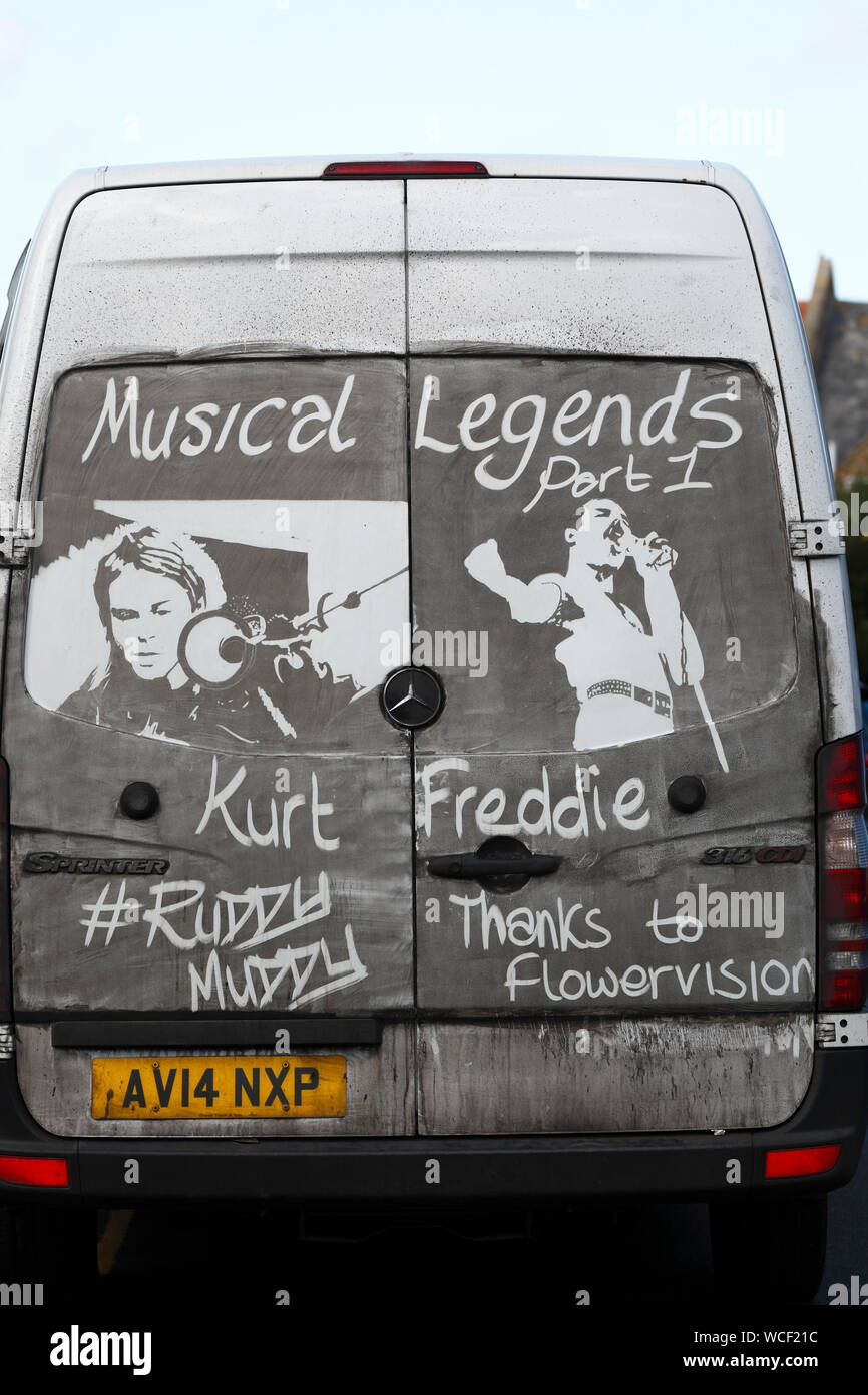 Ruddy Muddy's artwork on the back of a dirty white van. Stock Photo