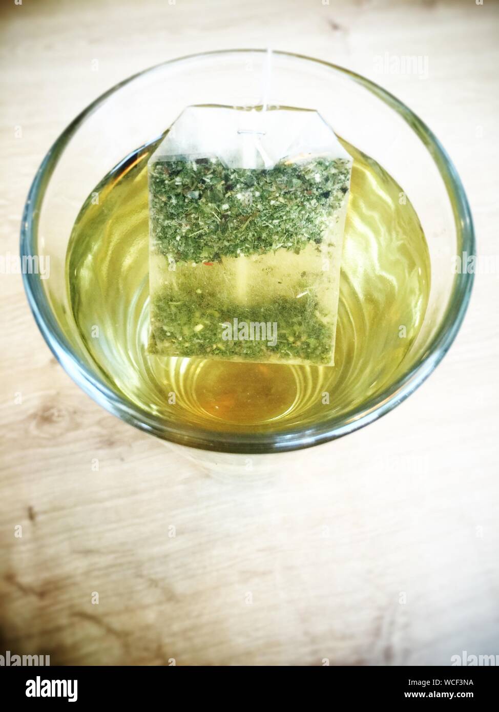 Close-up Of Herbal Tea With Teabag In Glass Stock Photo
