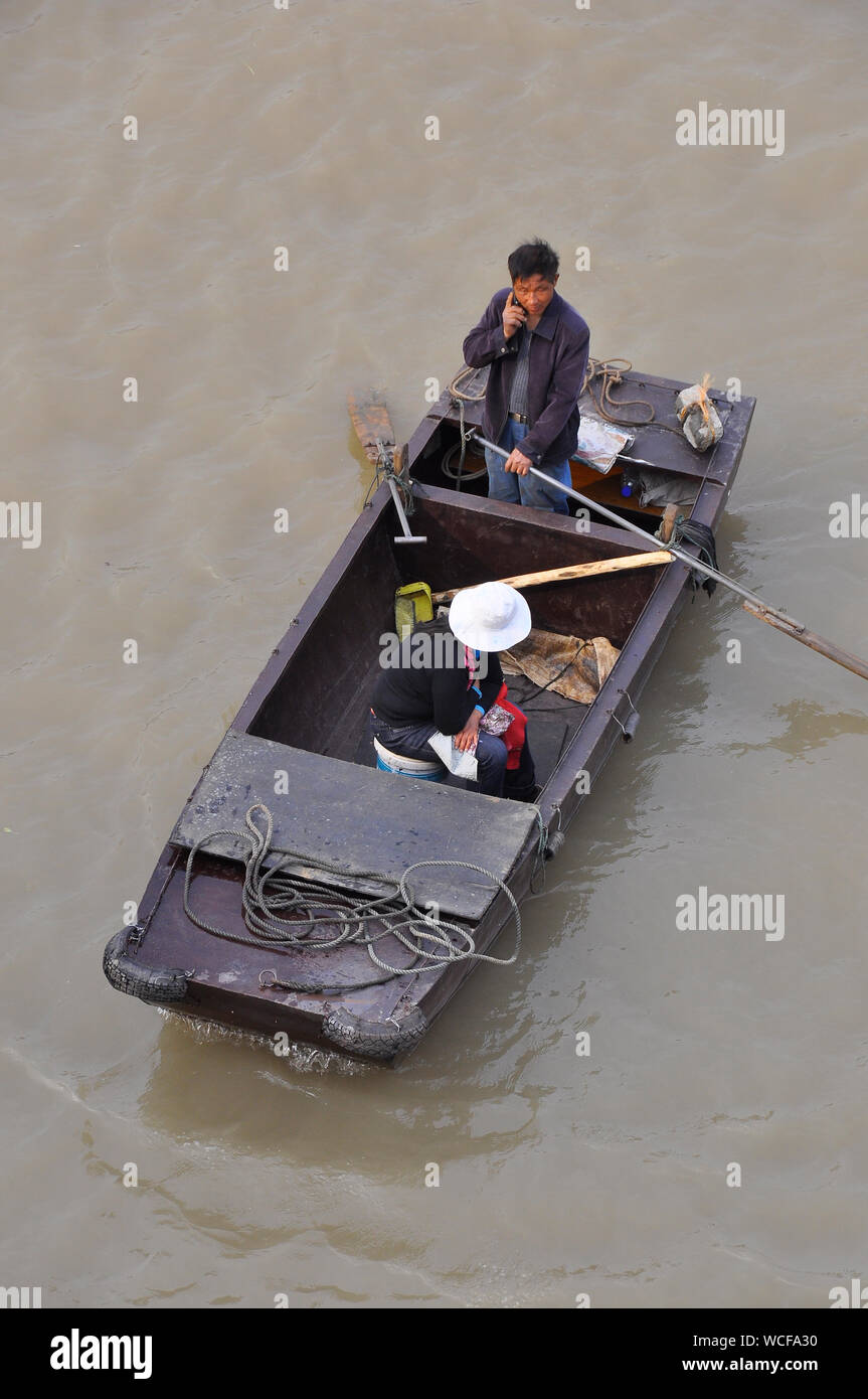 Activity on the canal barges of the canal boat community in Nantong, Jiangsu, China Stock Photo