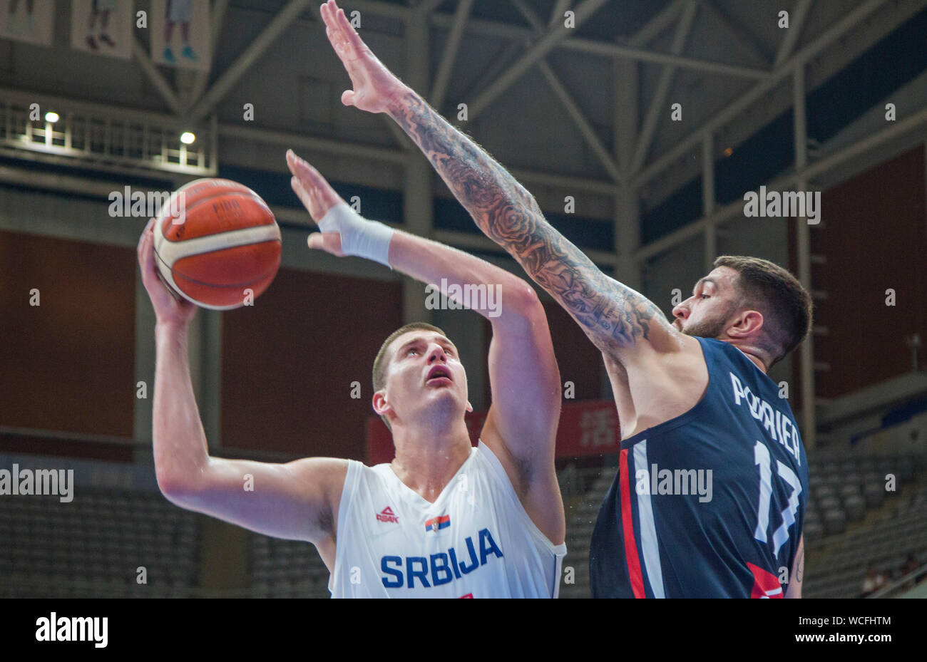 Nikola Jokic of Serbia, left, jumps for a lay-up during the final of 2019 International Basketball Championship against France in Shenyang city, northeast China's Liaoning province, 27 August 2019. Serbia defeated France with 61-56 at the final and wins the championship of 2019 Shenyang International Basketball Championship in Shenyang city, northeast China's Liaoning province, 27 August 2019. Stock Photo