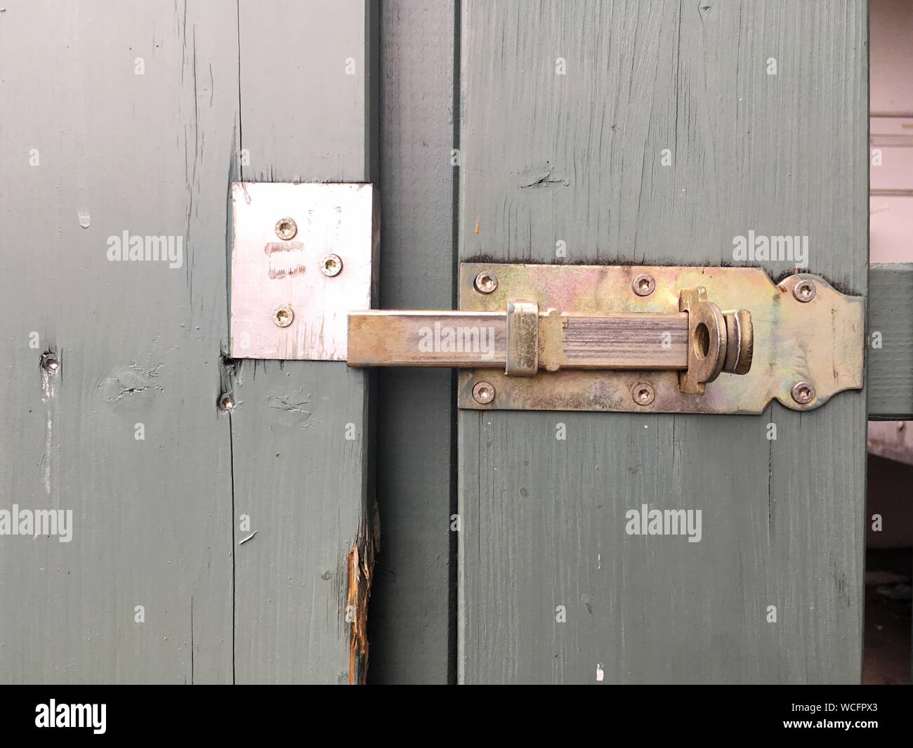 Close-up Of Door With Latch Stock Photo