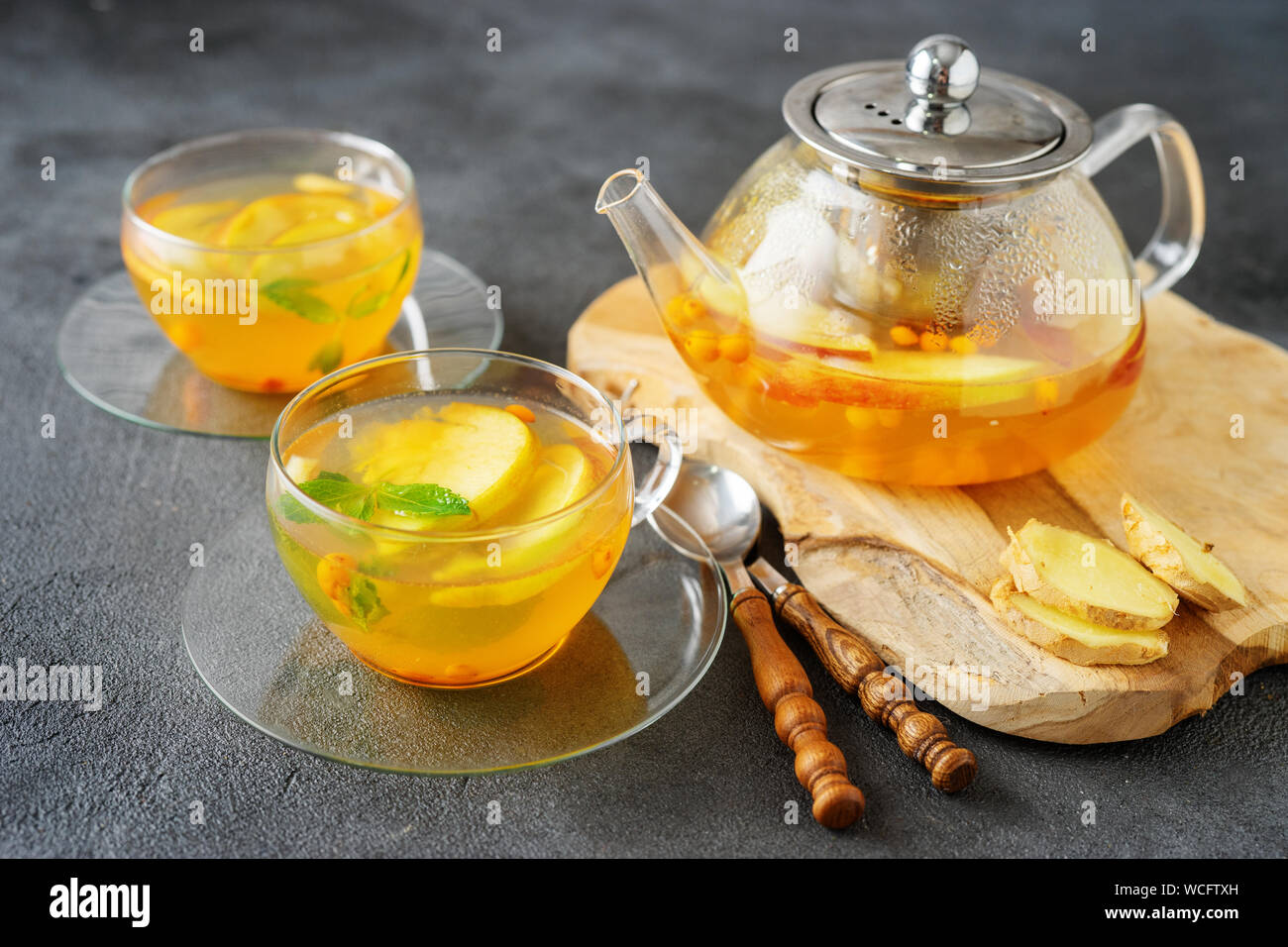 Tea set composition with hot tea on dark grey background Stock Photo