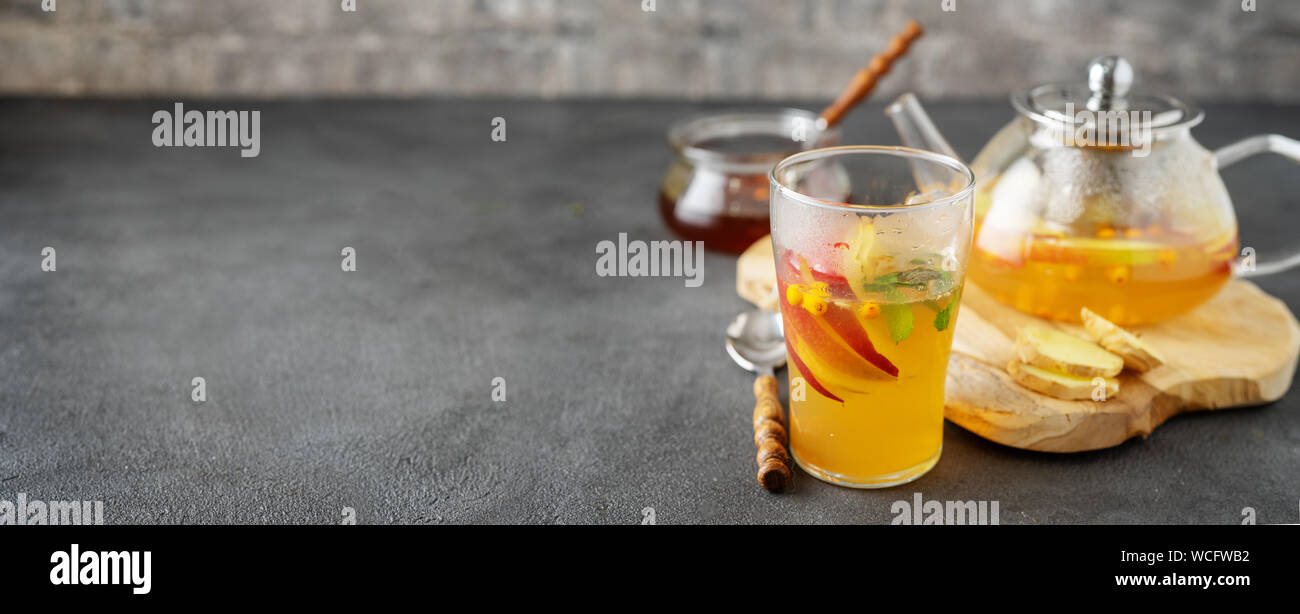 Tea set composition with hot tea on dark grey background Stock Photo