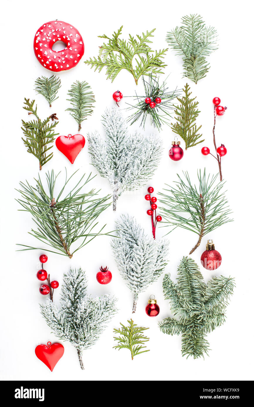 Christmas background with green fir branch, red holly berries and ...