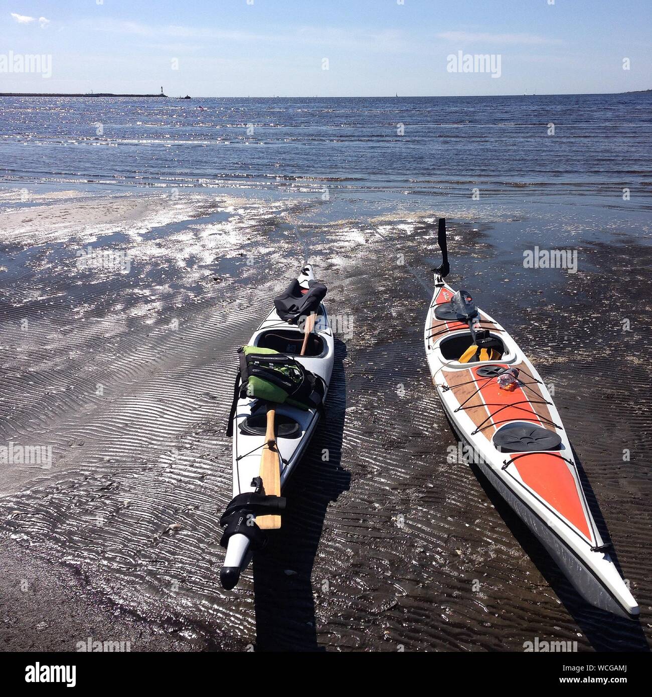 High Angle View Of Kayak On Beach By Sea Stock Photo