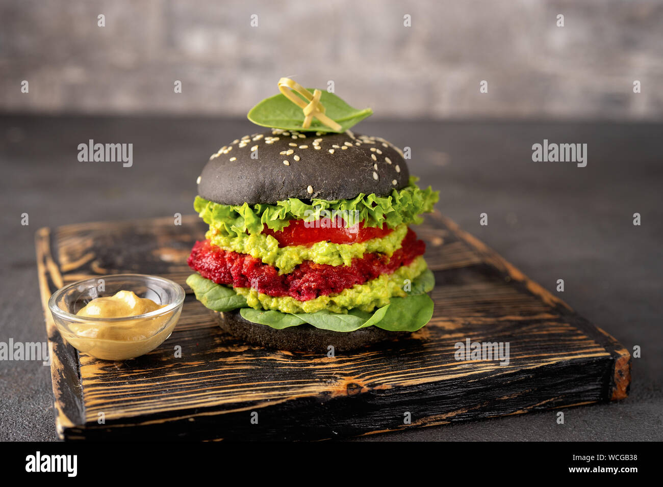 A rose flower in a black burger box Stock Photo - Alamy