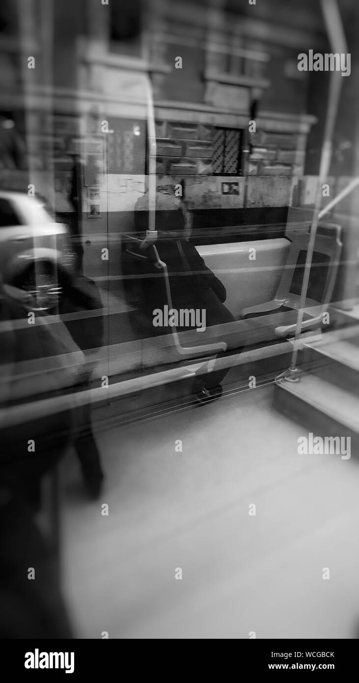 Person Sitting In Bus Seen Through Window At Night Stock Photo - Alamy