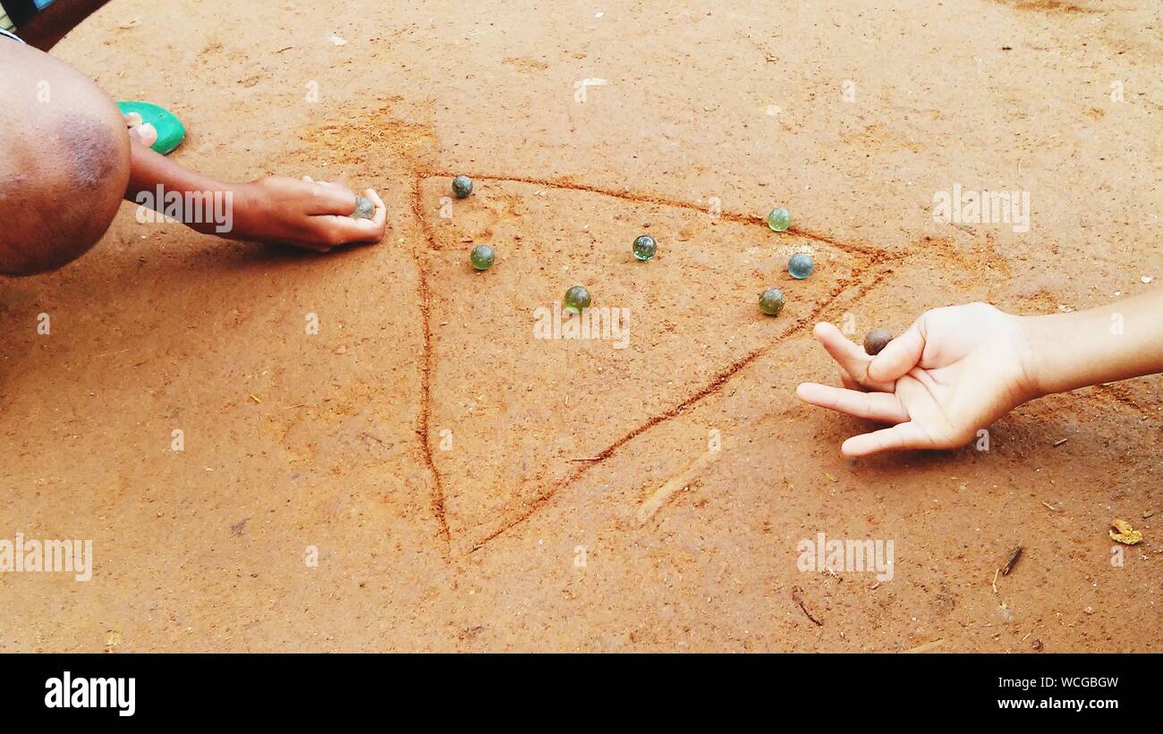 Boys Playing With Marbles High Resolution Stock Photography and Images