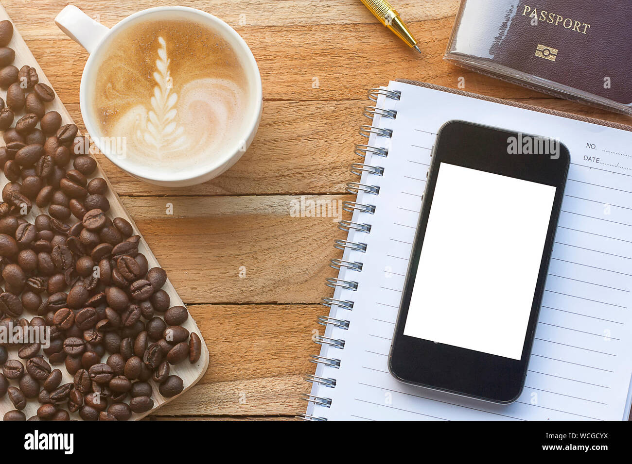 Download High Angle View Of Coffee Cup With Mobile Phone And Book On Table Stock Photo Alamy PSD Mockup Templates