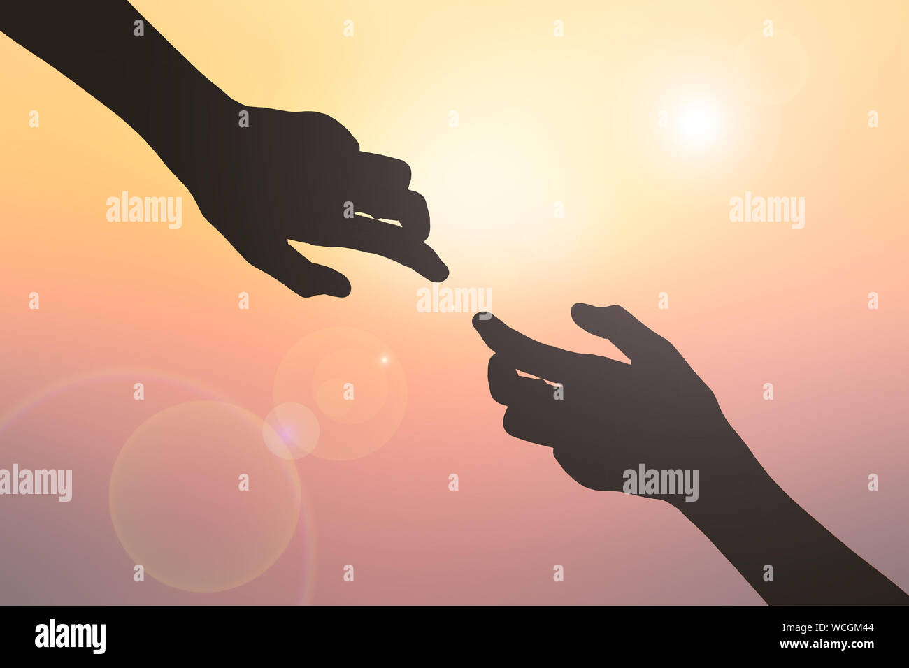 Cropped Image Of Silhouette Hands Against Shining Sun During Sunset Stock Photo