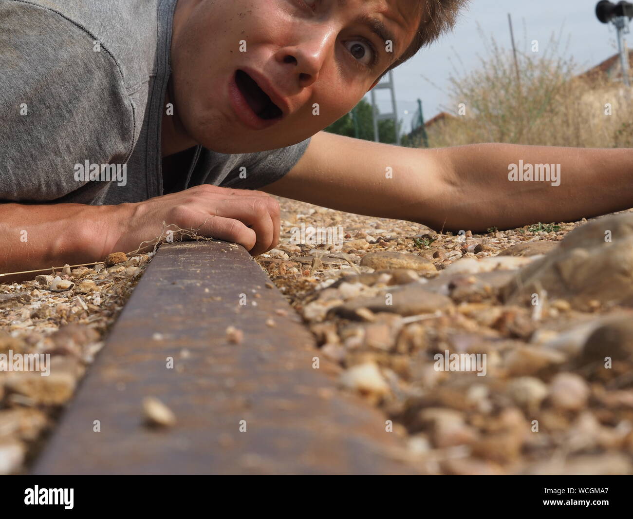 Portrait Shocked Man On Abandoned Railroad Track Stock Photo Alamy