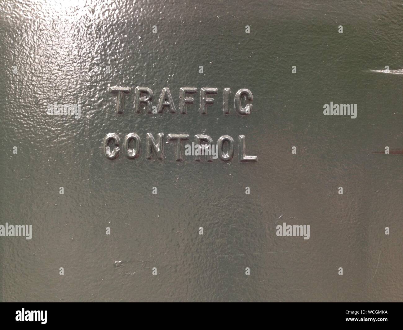 Full Frame Shot Of Frosted Glass With Traffic Control Text Stock Photo