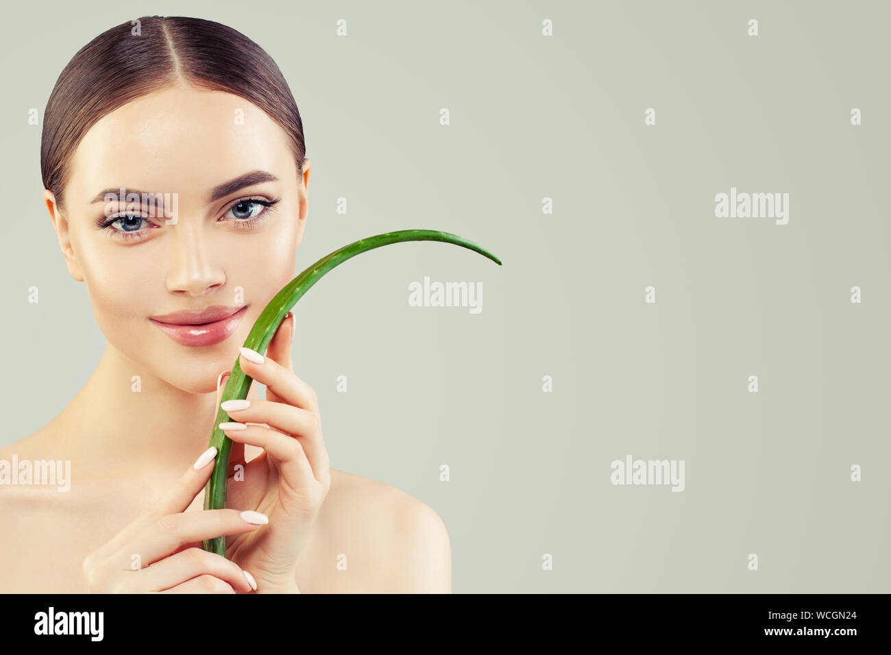 Beautiful model woman with aloe vera leaf portrait Stock Photo - Alamy