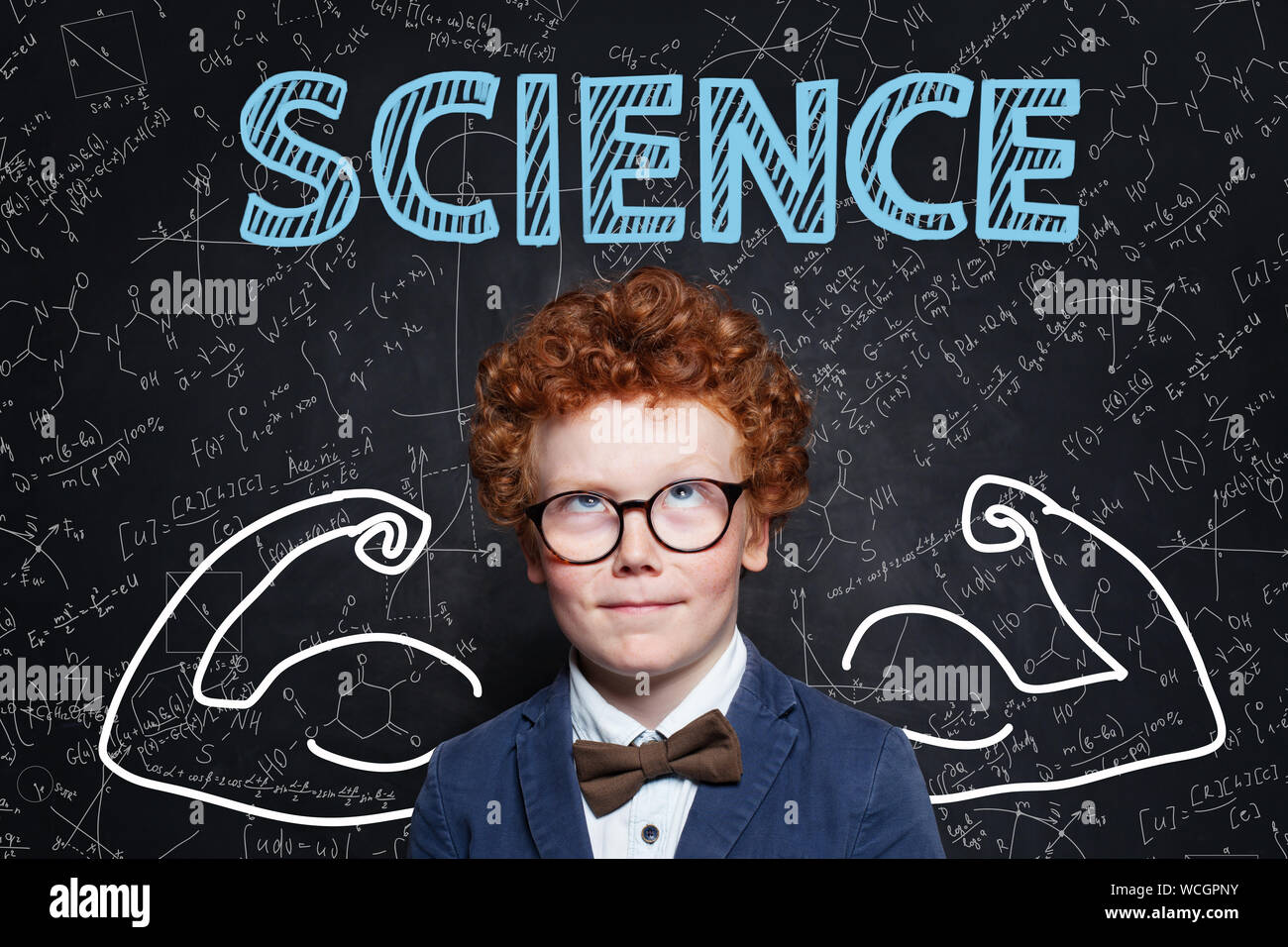 Successful school boy with ginger hair on science background. Learn science and science power concept Stock Photo