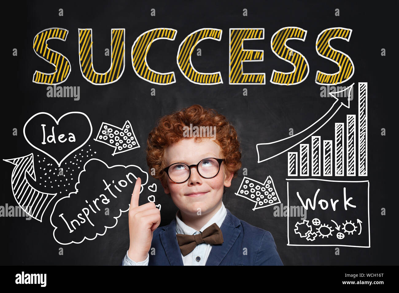 Successful smart child boy businessman pointing at success inscription ...