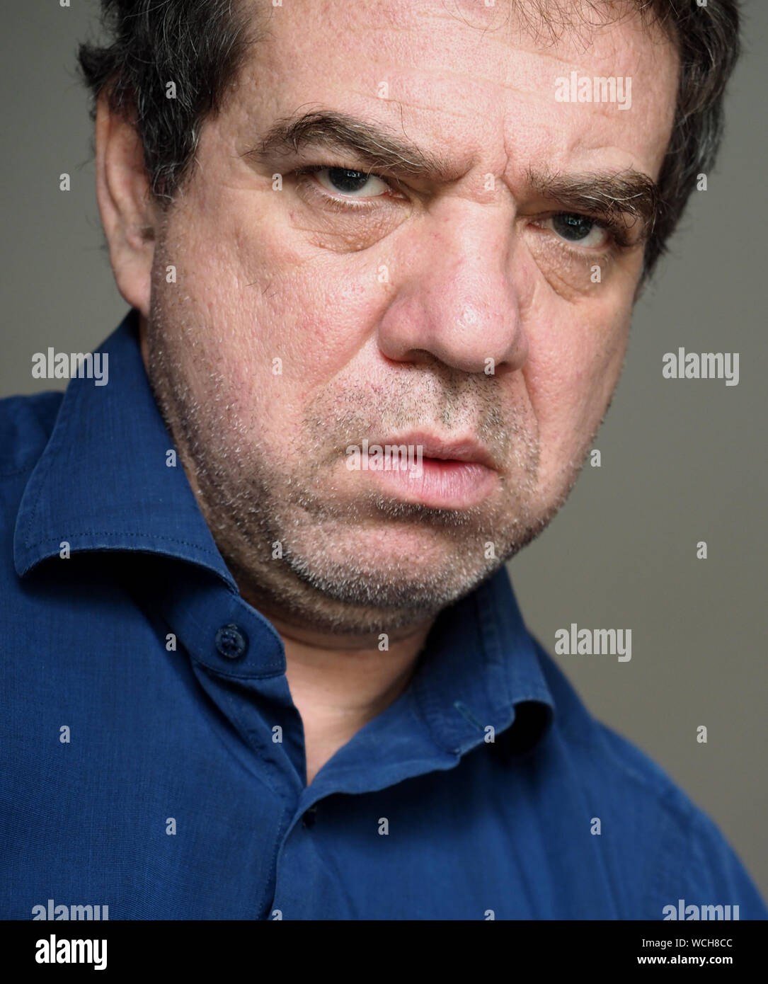 Close-up Portrait Of Angry Man Stock Photo